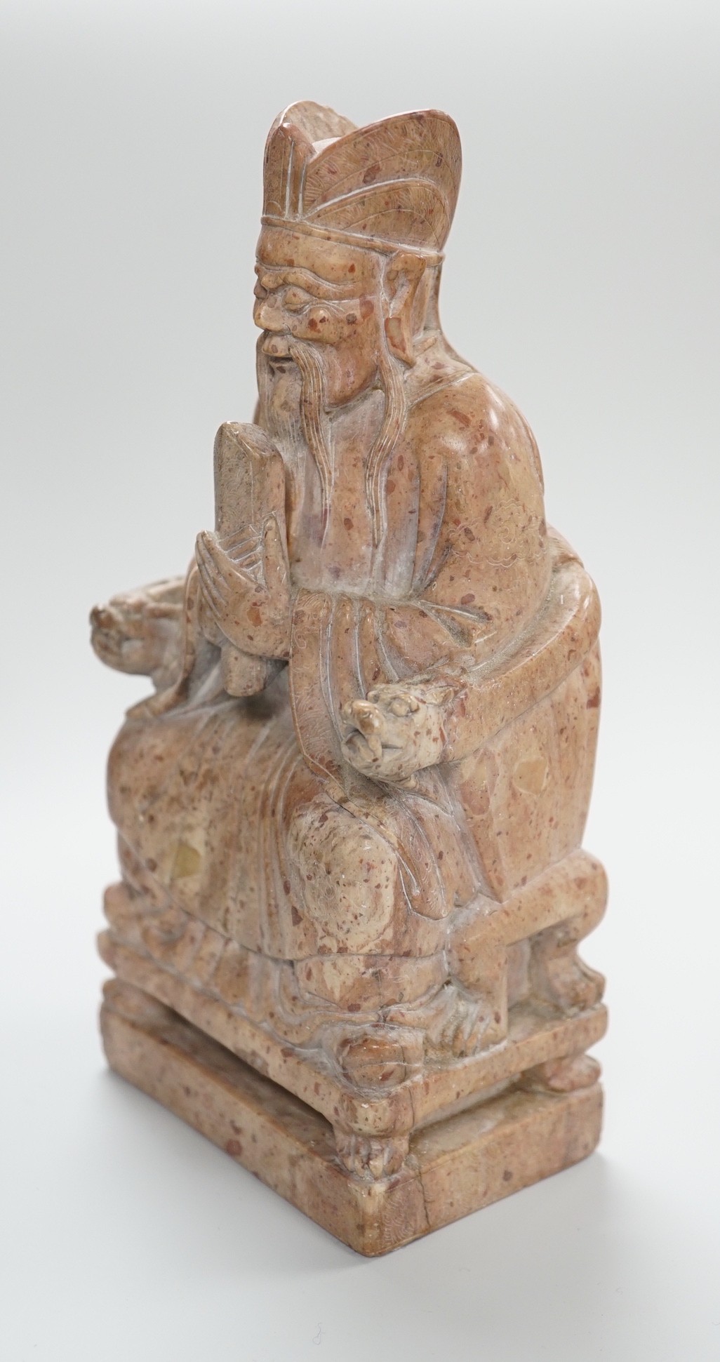 A Chinese soapstone seated figure of an Emperor, 19cm tall